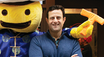 Brian Goldberg with the Mr. Bing mascot.