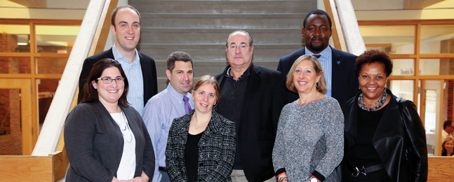 Photo of eight new Alumni Board members