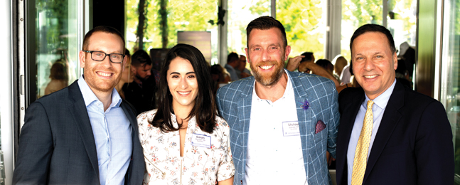 Attendees at university event at Manhattan's City Vineyard at Pier 26.