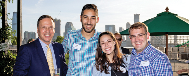 Attendees at university event at Manhattan's City Vineyard at Pier 26.