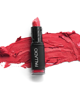 Photo of an opened lipstick against the background of the lipstick pigment, splashed like paint.