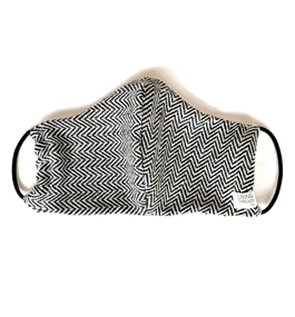 Photo of a face mask, made from cloth woven in a black-and-white herringbone pattern.