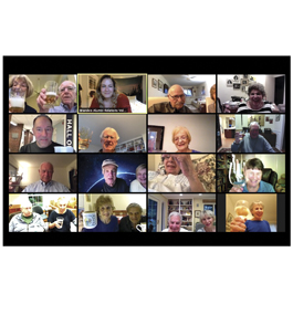 Screenshot capture of a Zoom get-together, with many of the participants raising a glass toward the camera.