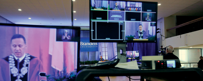 Photo of different video screens and equipment capturing President Ron Liebowitz as he conducts the 2021 Commencement ceremony