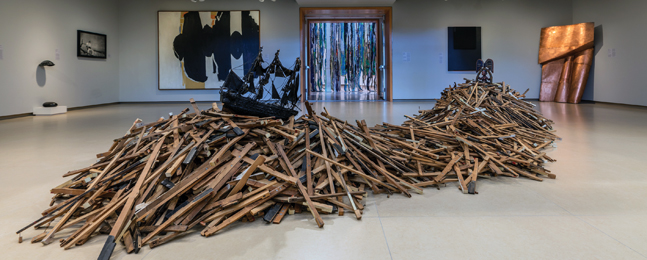 Radcliffe Bailey, Storm at Sea, 2007. Piano keys, African sculpture, model boat, paper, acrylic, glitter, gold leaf.