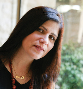 Head shot of a woman with long dark hair