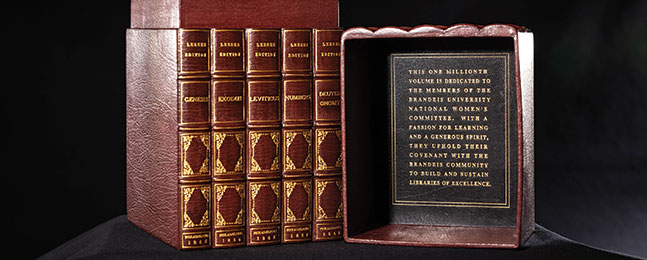 A brown leather case containing five leather books; the inside of the case's lid is inscribed in gold leaf.