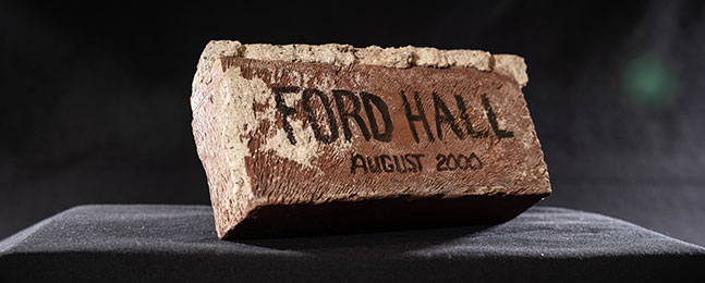Photo of a brick inscribed "Ford Hall / August 2000"