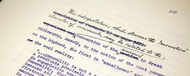 Photo of a typewritten manuscript page with handwritten edits.