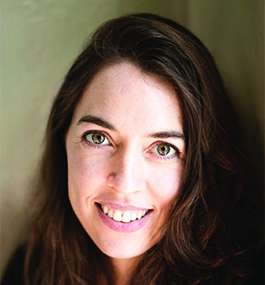 Headshot of a smiling woman with dark hair