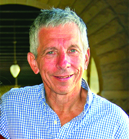 Headshot of a smiling man