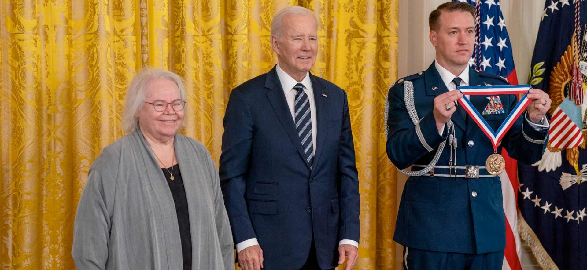 Eve Marder stands with President Joe Biden as she is awarded with the National Medal of Science