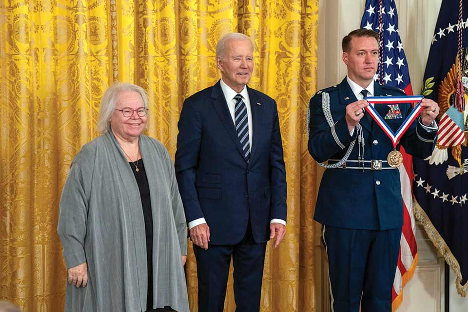 Eve Marder stands with President Joe Biden as she is awarded with the National Medal of Science