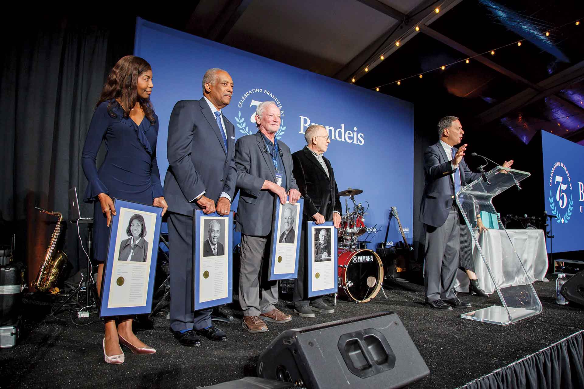 Cheryl Pegus ’84, Curtis Tearte ’73, Frederick Alt ’71, and Chuck Israels ’59 receive 2023 Alumni Achievement Awards from President Ron Liebowitz.