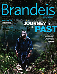 Winter 2023/2024 Magazine cover featuring a man walking through the dark woods