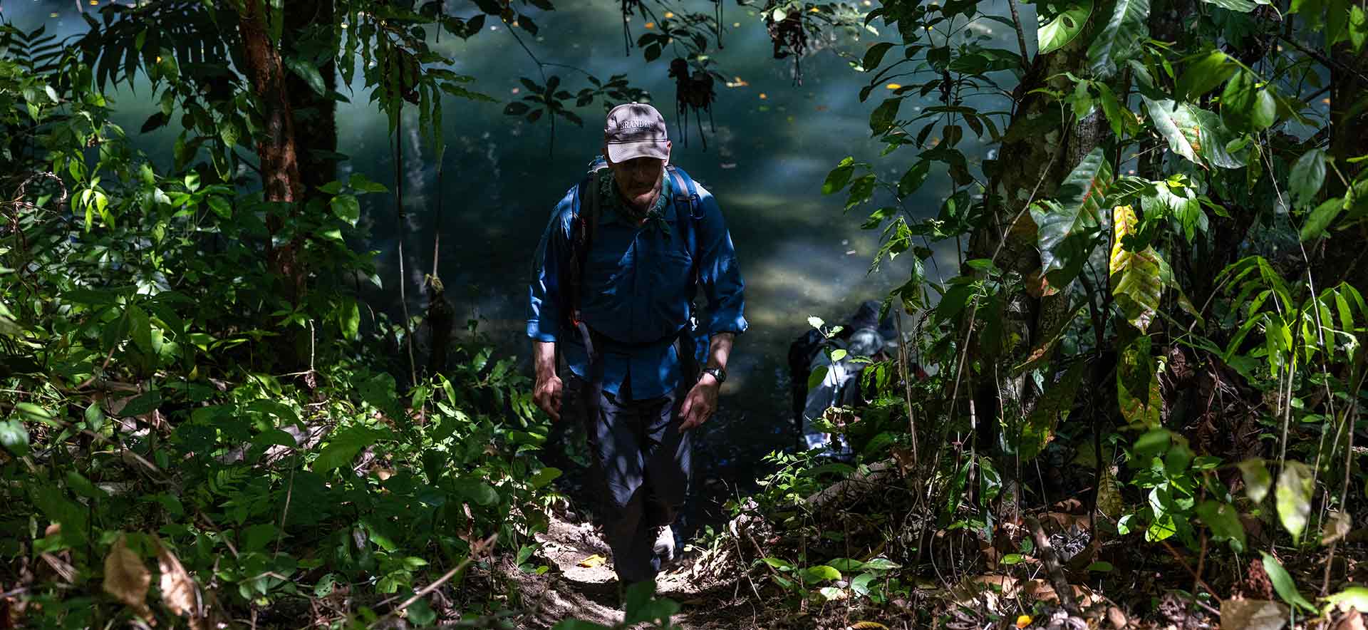 Charles Golden walks through the jungle