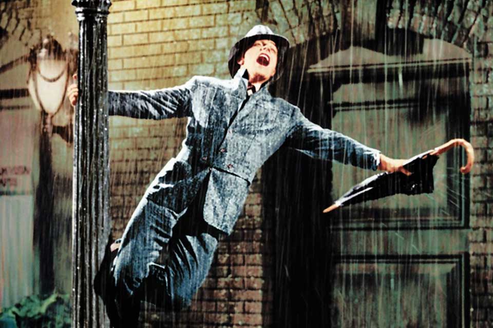 Gene Kelly singing in the rain in Singing in the Rain