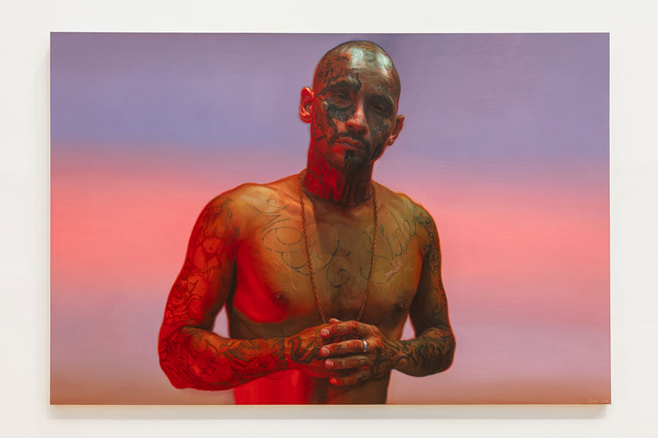 A painting of a man standing in front of a sunset from Vincent Valdez's “Just a Dream …”