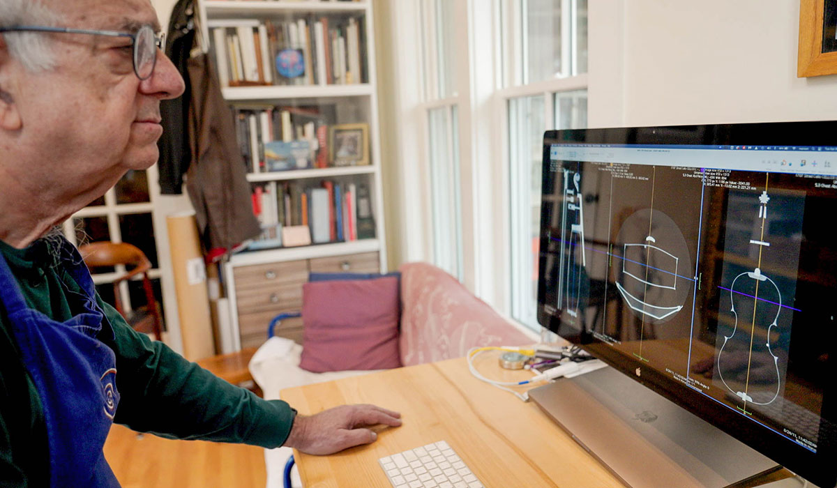 Mairson looks at a scan of an instrument on his computer.