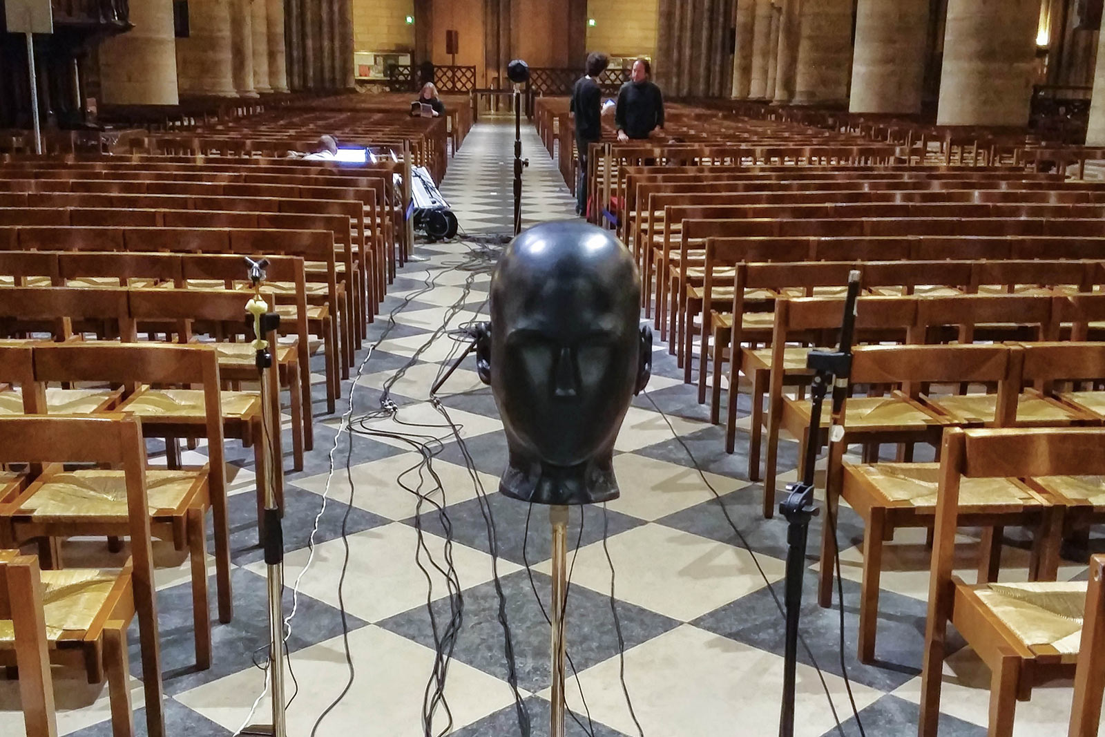 A microphone in the shape of a head inside Notre-Dame