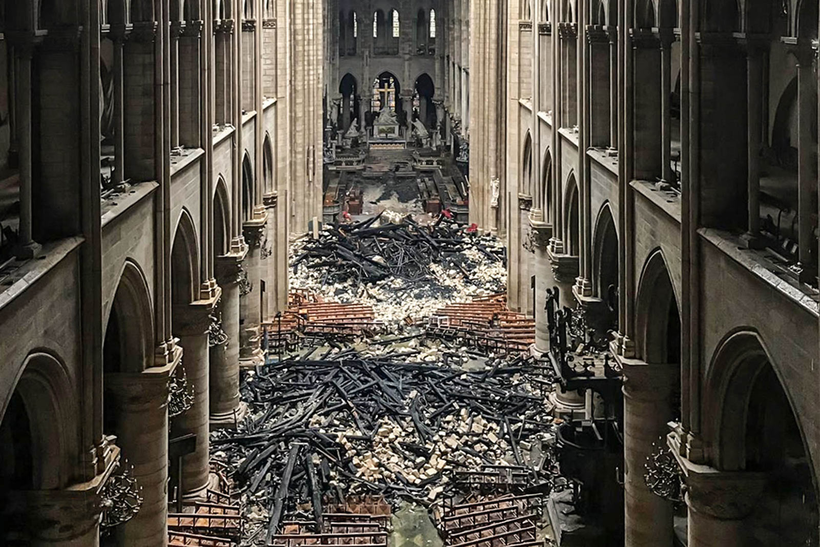 Piles of burnt timber and shattered limestone inside the cathedral.
