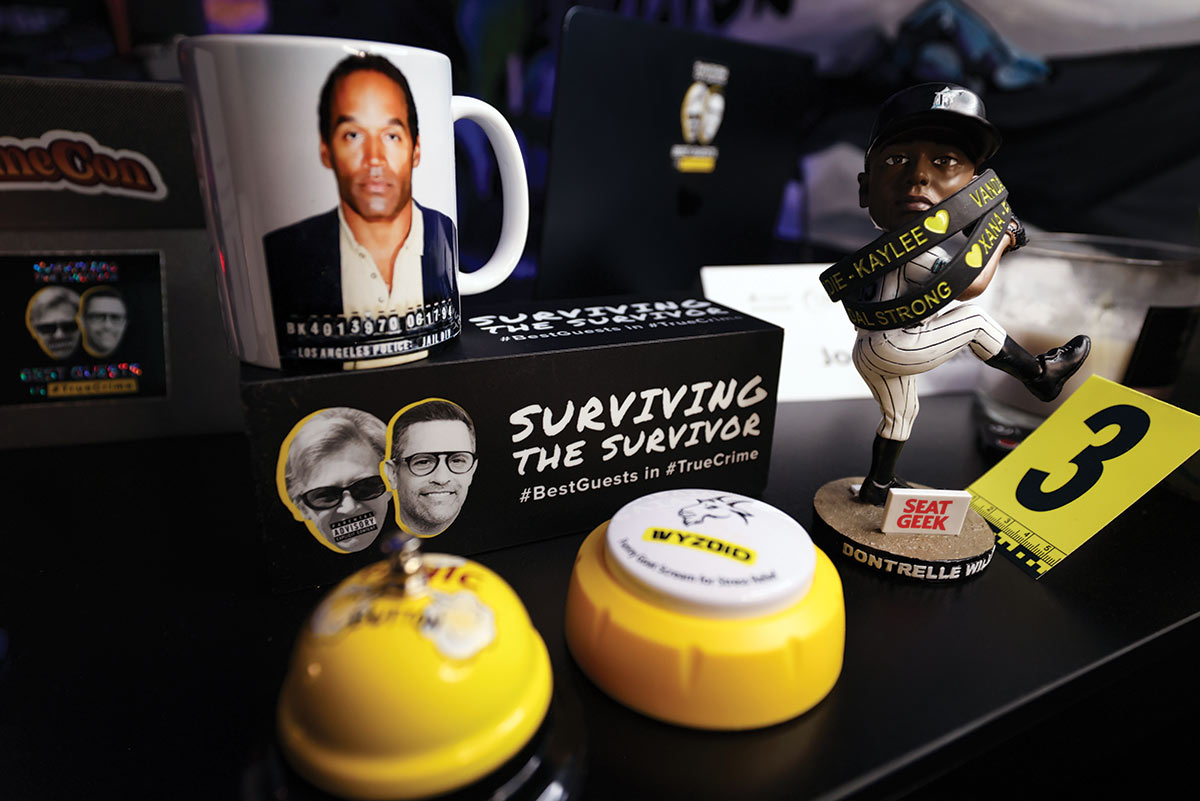 Various items and awards related to the Surviving the Survivor podcast