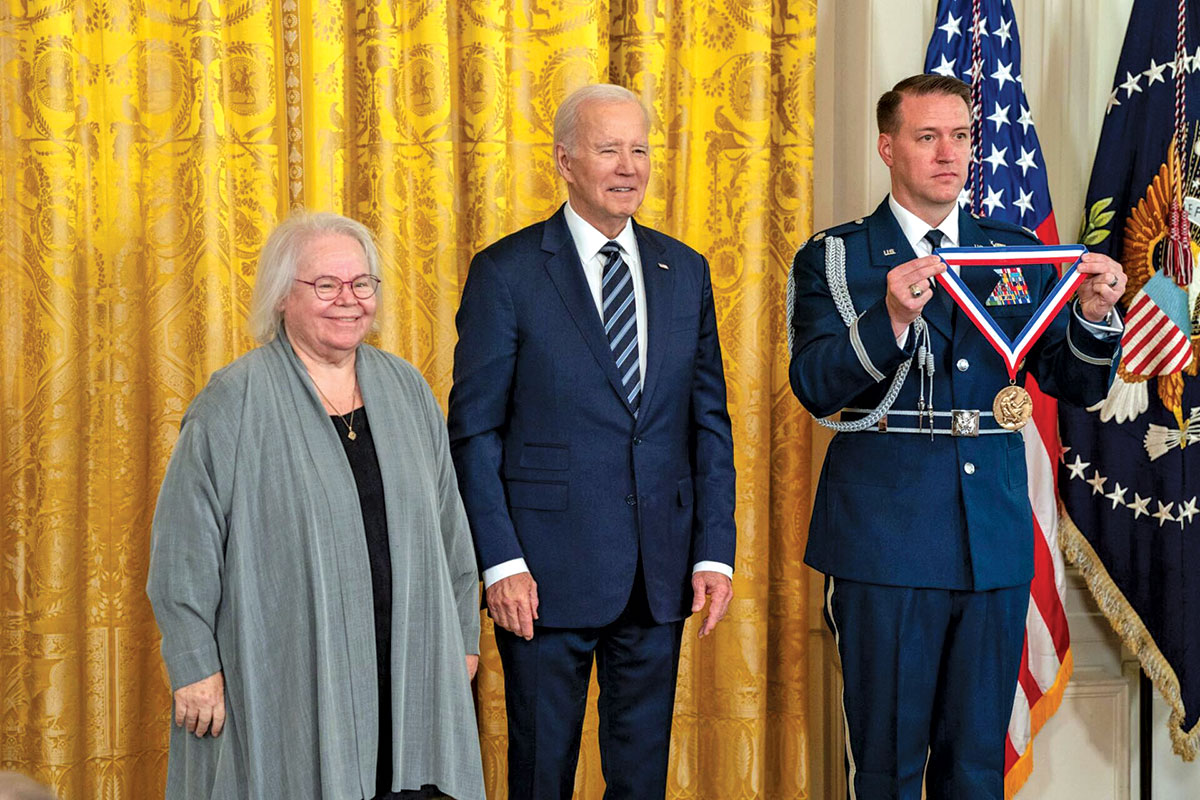Eve Marder stands next to President Biden at a ceremony to receive the National Medal of Science.