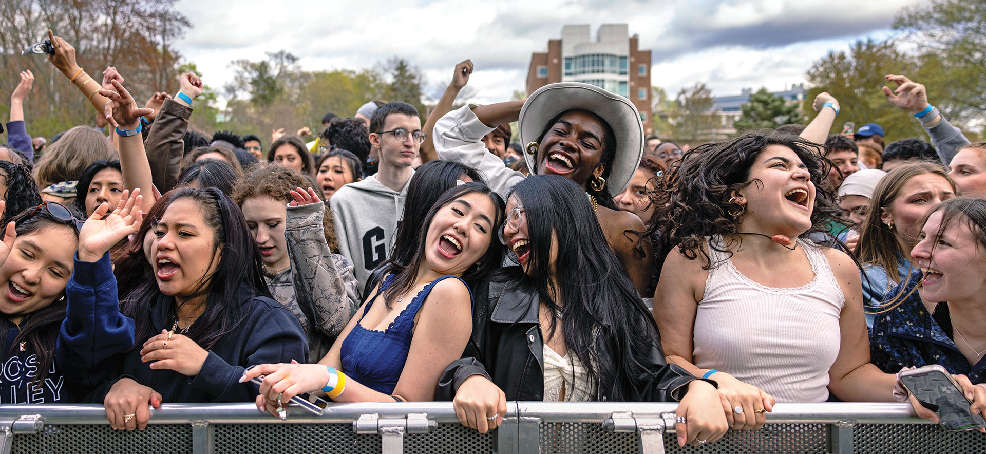 A crowd of students dance together at a Springfest concert.