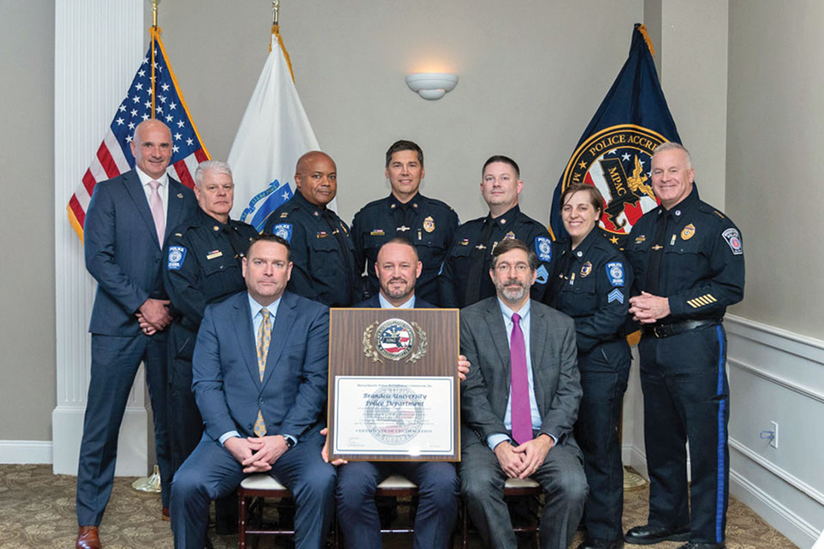 Brandeis staffers pose for a group photo with the MPAC certification plaque.