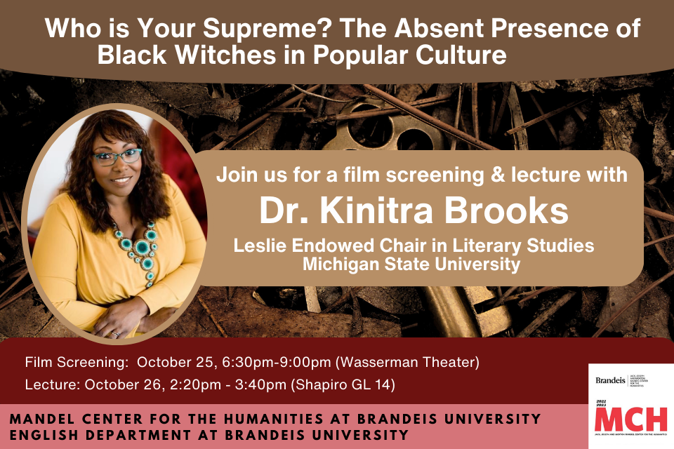  A photo of Dr. Kinitra Brooks in an object shaped like a key with autumn leaves behind