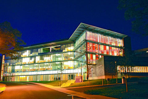 A window-laden Mandel Center lit up a night.