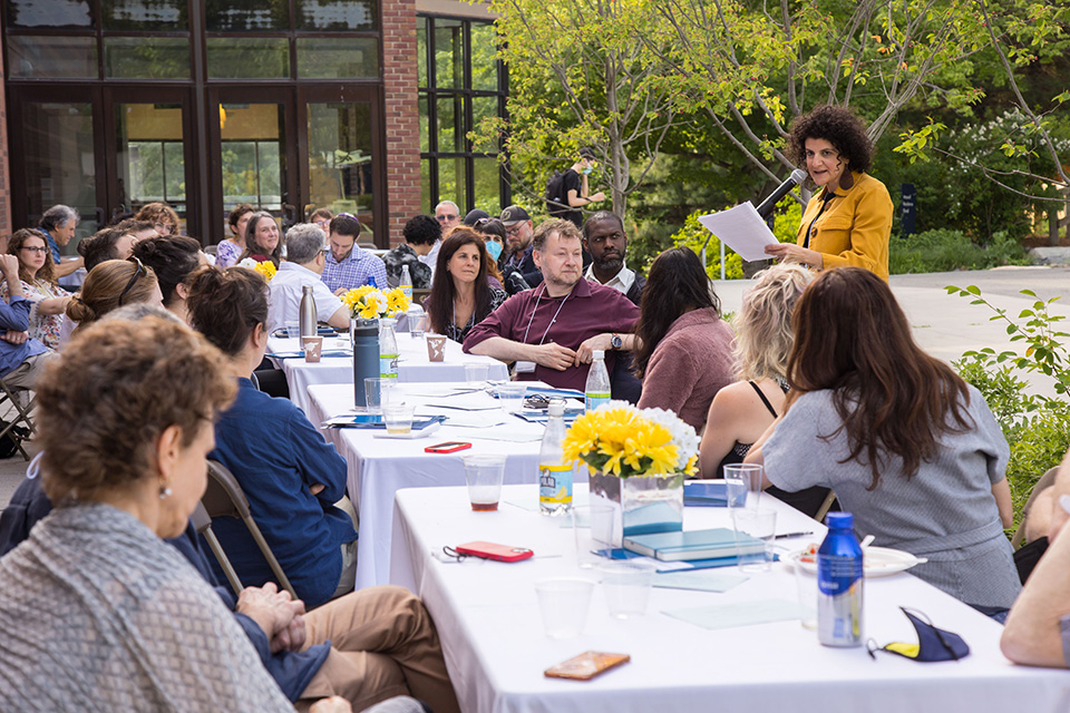 Group of conference attendees at a long table