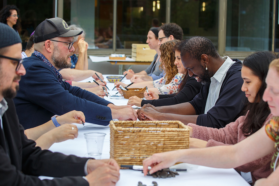 Participants at a long table.