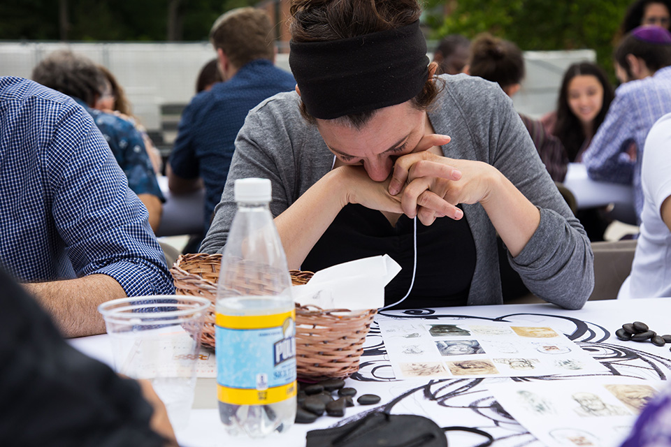 Participant looking down at her artwork.