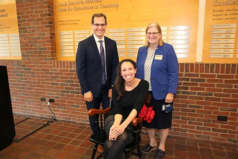 Ziva Hassenfeld sits in front of Jon A. Levisohn and Carol Fierke