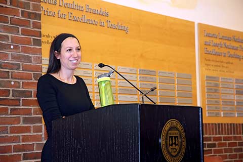 Ziva Hassenfeld stands at a podium