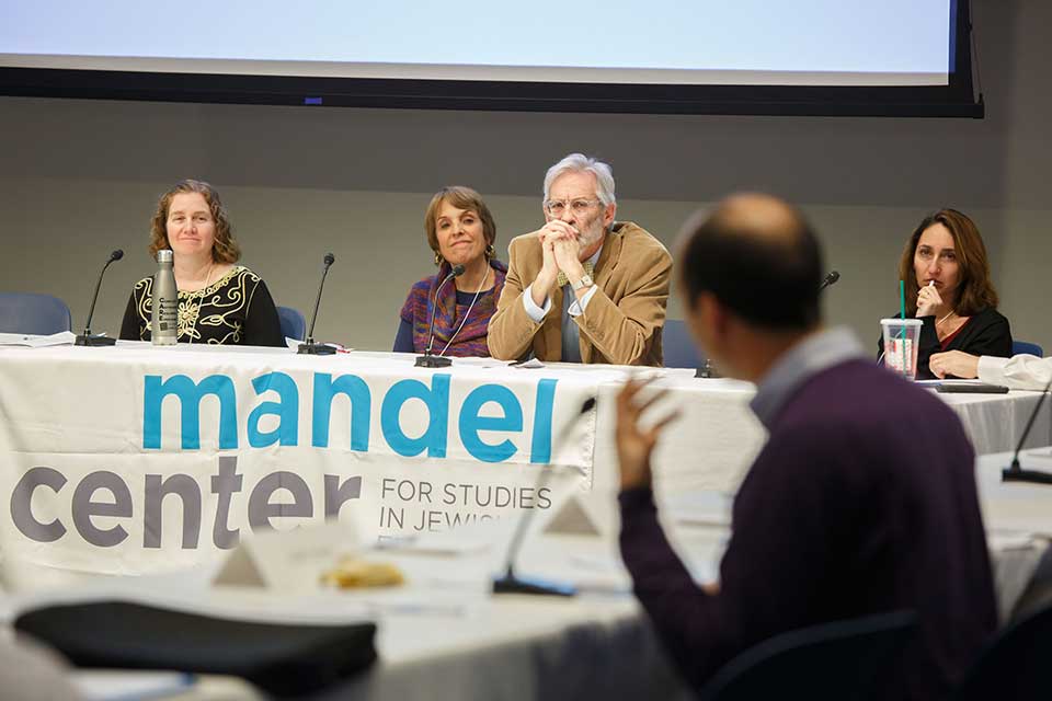 Panelists listen to a question from the audience
