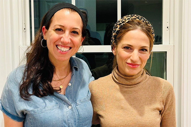 Ziva Hassenfeld and Hadar Fisher looking at camera