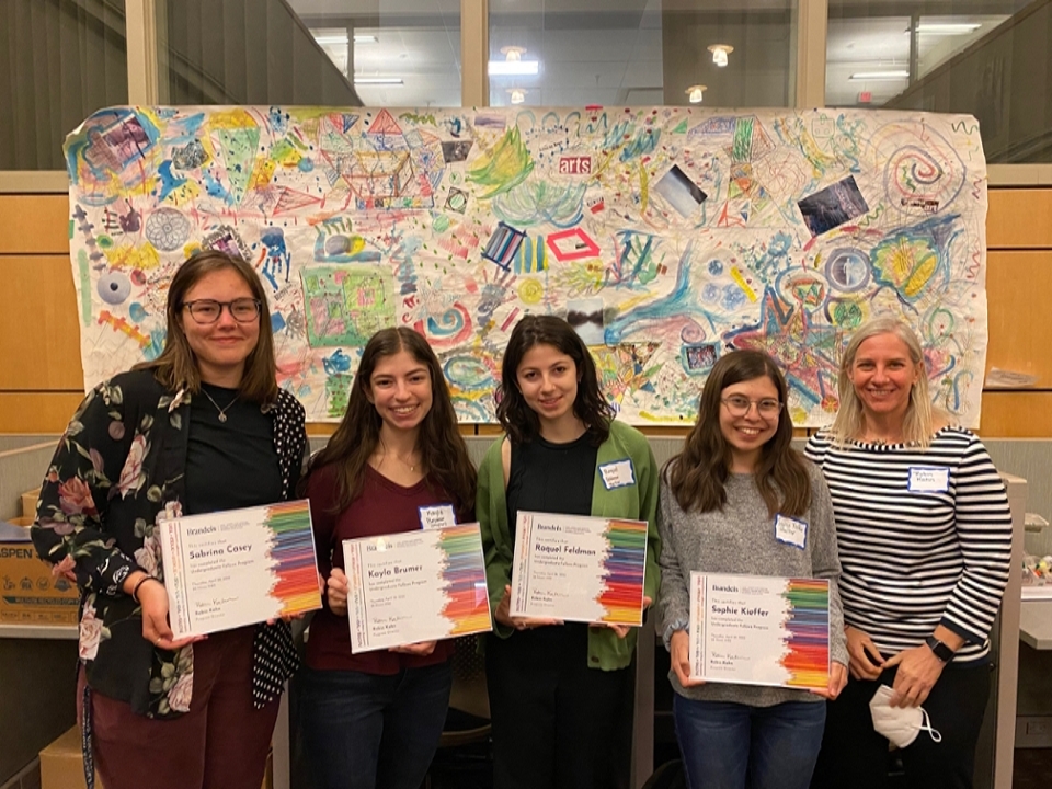 A group of 4 students holding certificates with their teachers