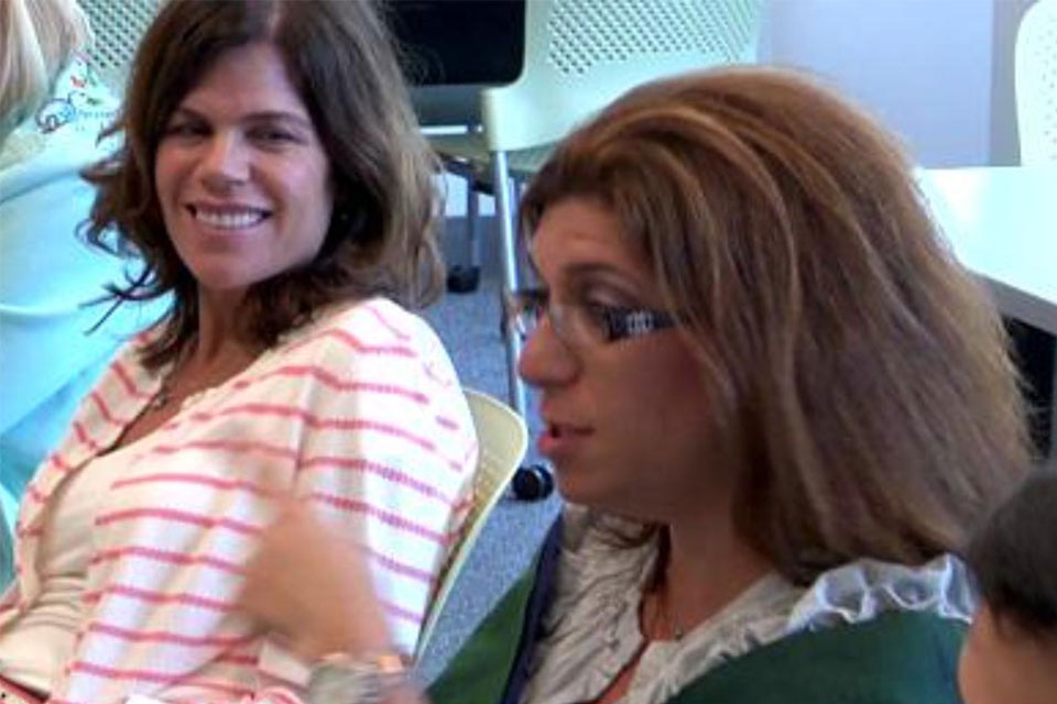 Two teachers sitting at a table