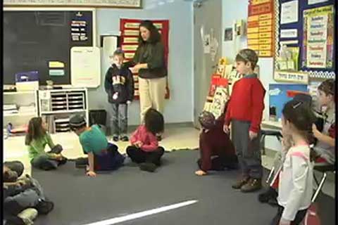 Shira Horowitz talks with young children in a classroom