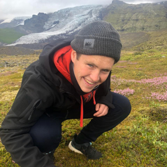 photo of Matthew Merovitz, a research assistant in the Memory and Cognition lab, posing for a picture in Iceland!