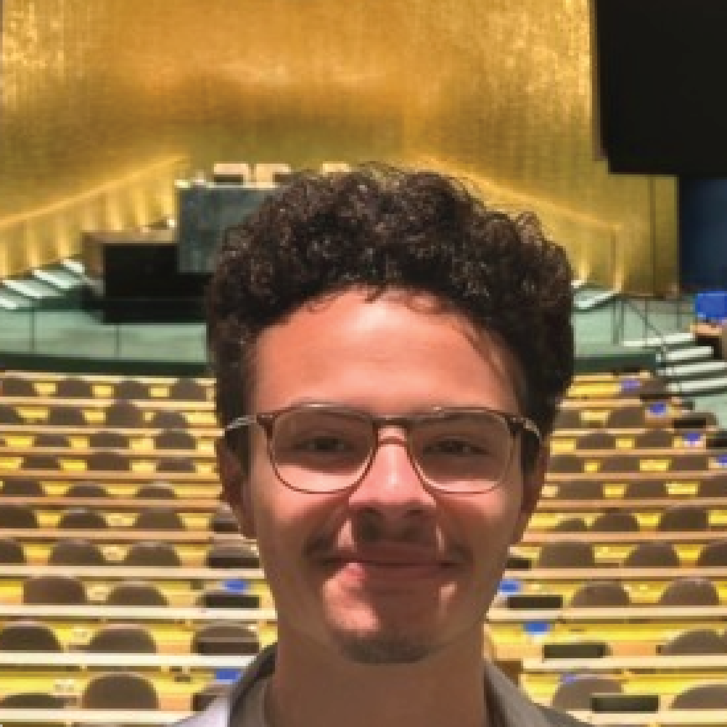 man in glasses smiling