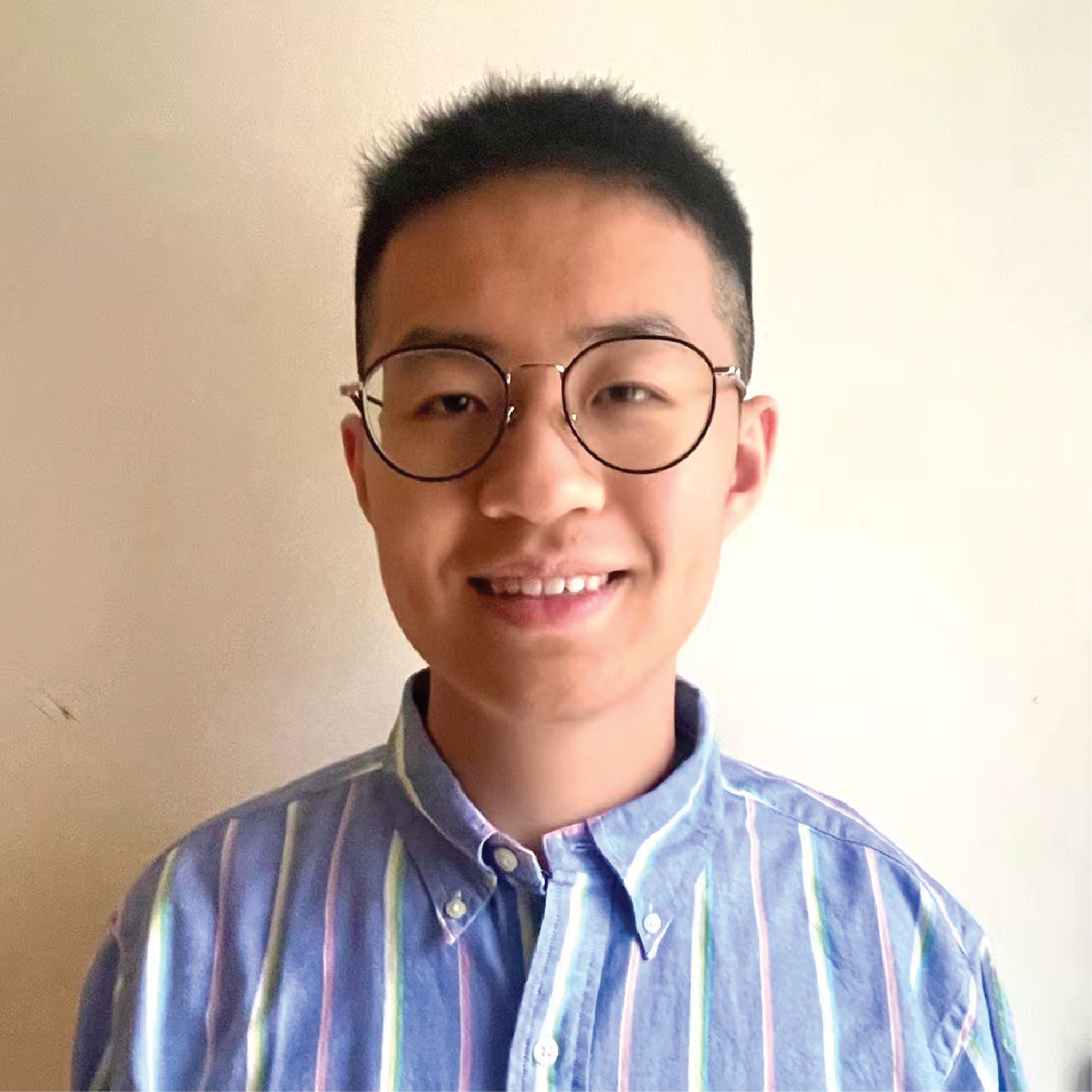 man in glasses smiling