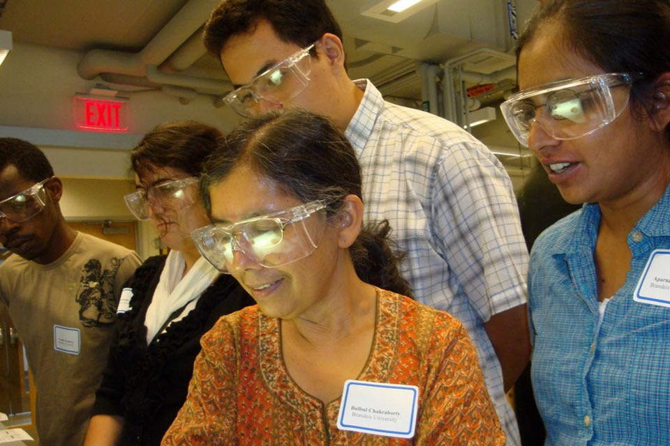 Scientists in a lab wearing safety goggles