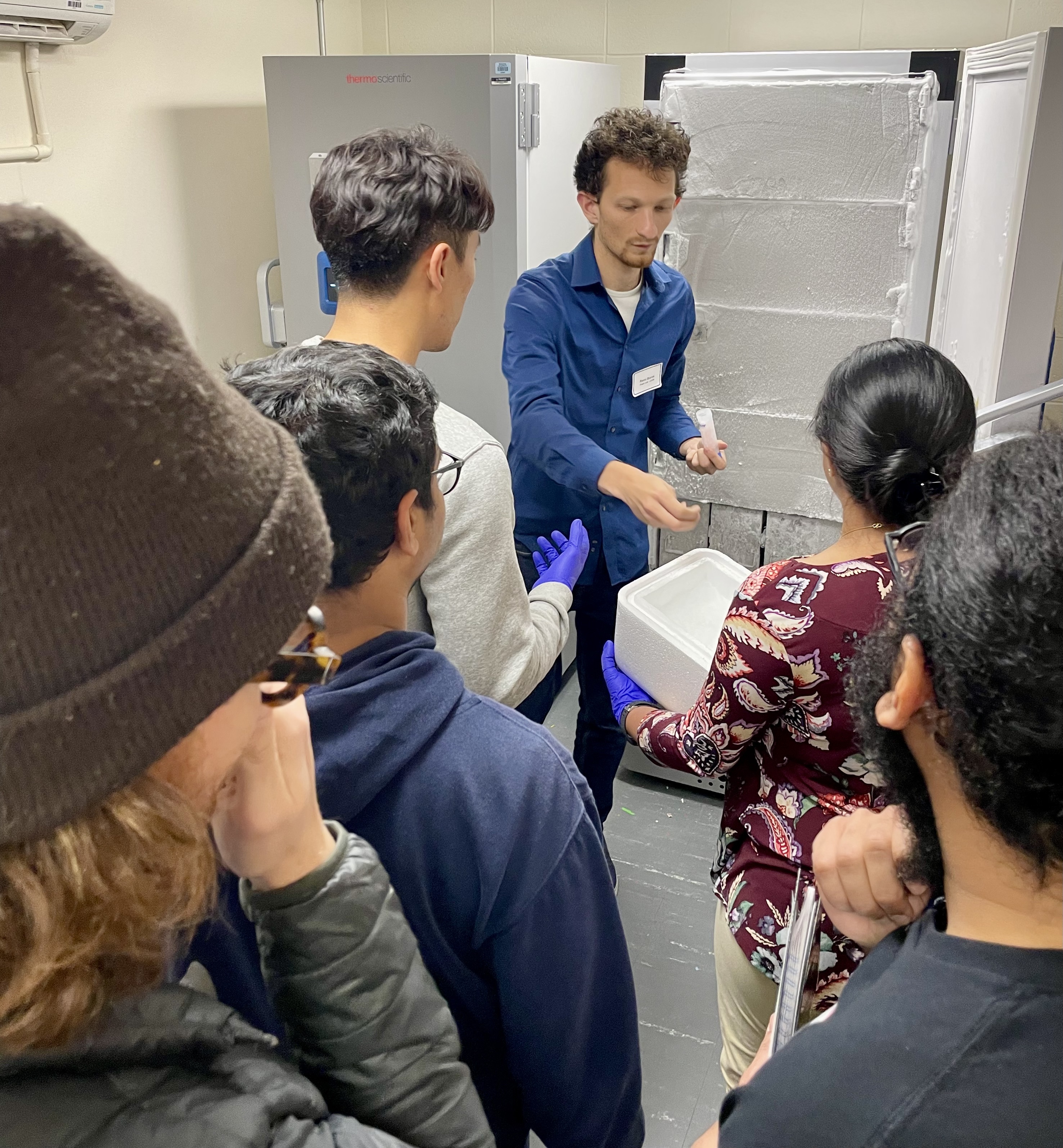 Remi Boros removing samples from a lab freezer.