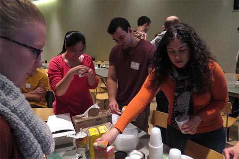 Retreat participants gathering materials.