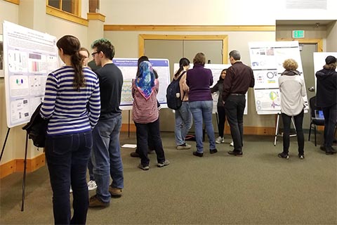 Participants at a poster session