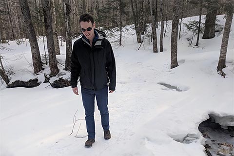 Participant hiking on a snowy trail