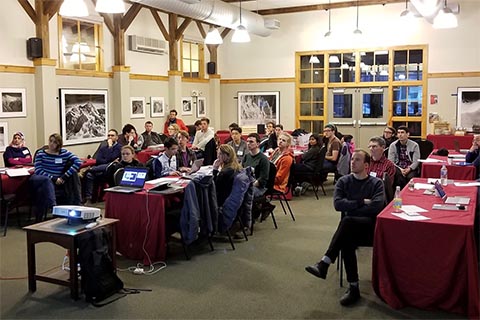 Participants watching a presentation